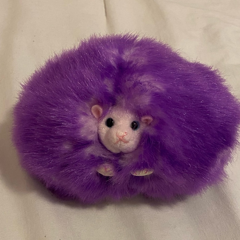 Purple Harry Potter Pygmy puff. Makes noise just like in the movies!